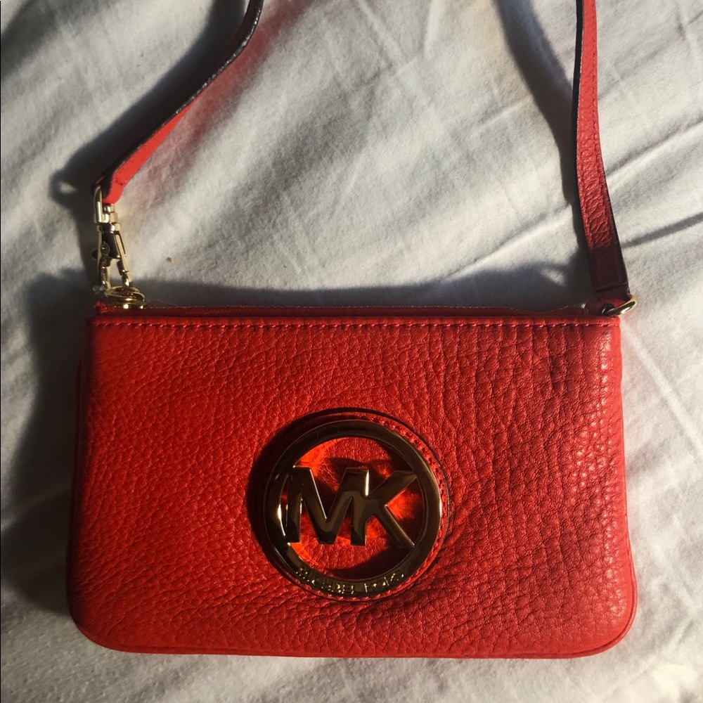 Red Michael kors wristlet